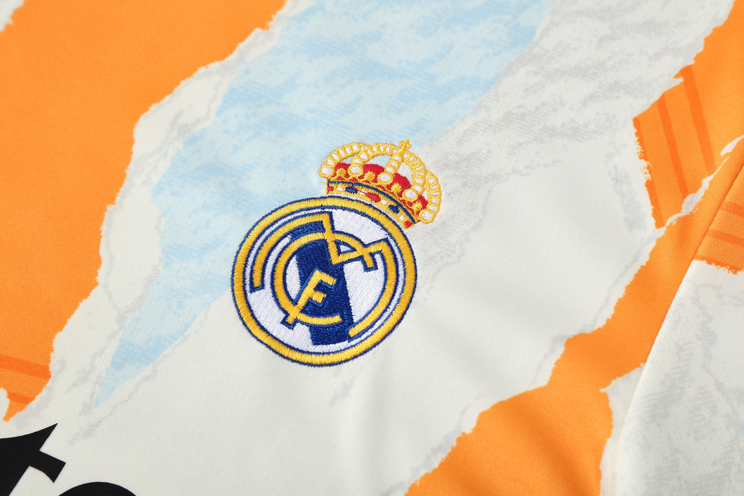 Real Madrid 2025/26 Training Shirt - Off-White/Orange